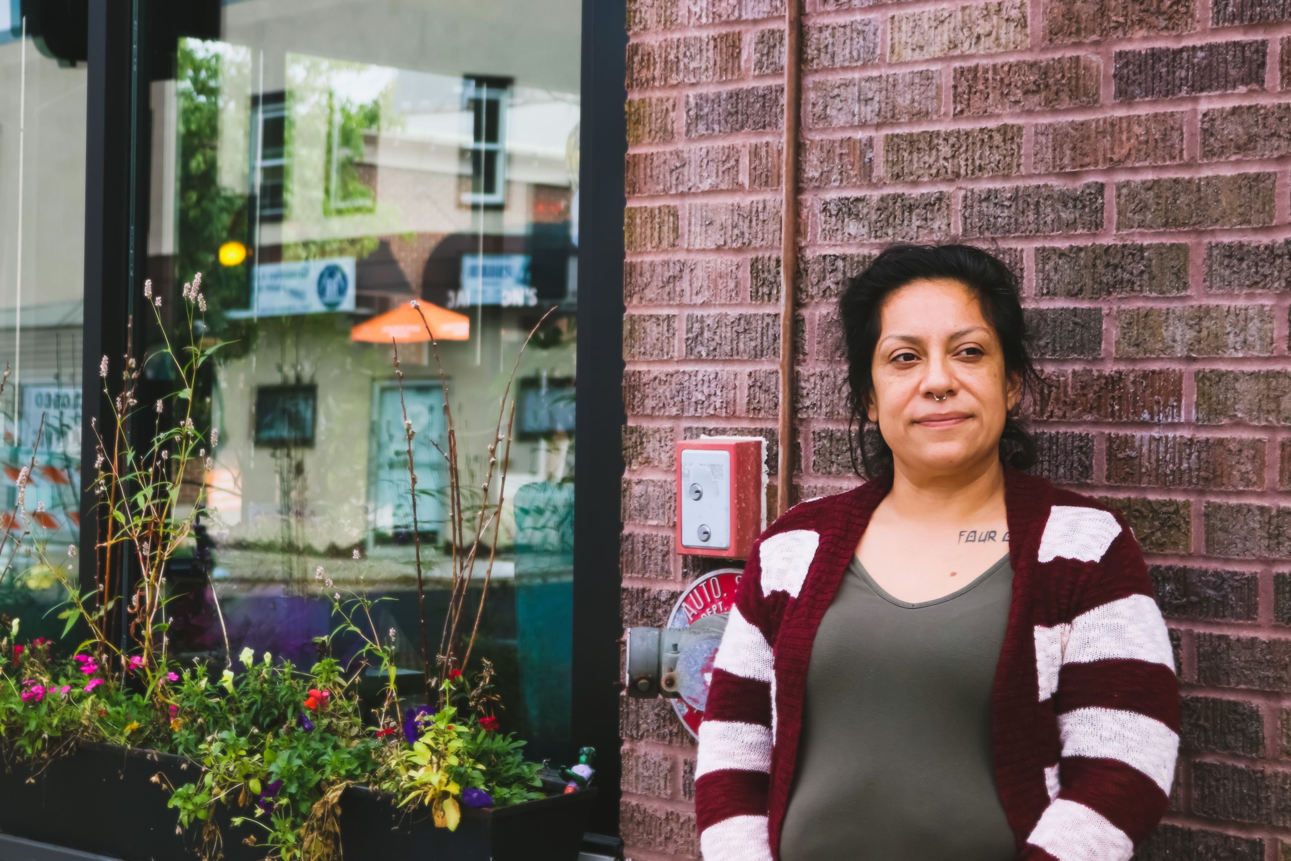 Elena standing outside Amore Coffee Shop in West St. Paul