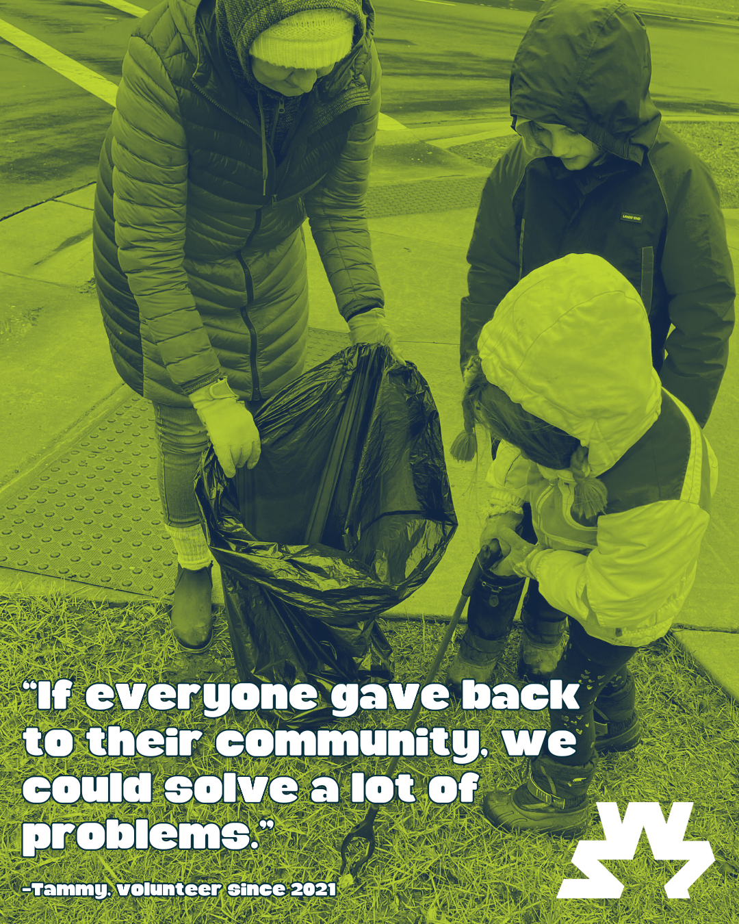 Image of adult picking up trash with kids